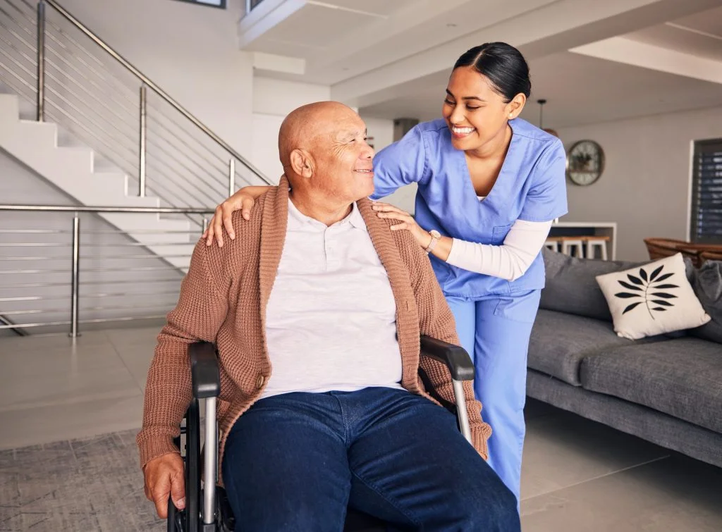 Nurse, smile and man with disability in wheelchair for medical trust, nursing therapy and support at home